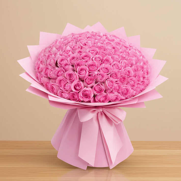 Bouquet of 100 pink roses wrapped in pink paper