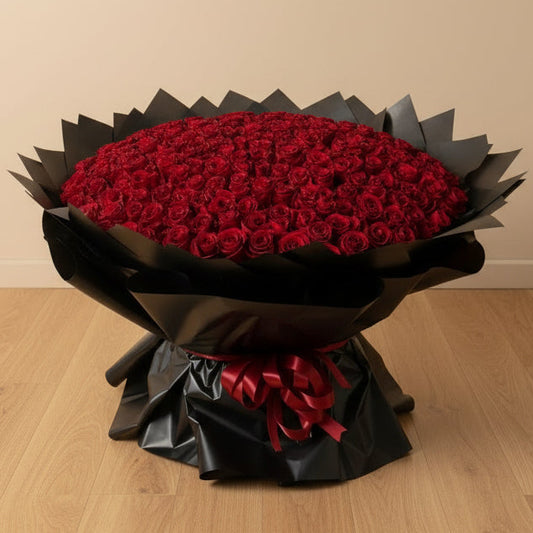 Bouquet of 300 red roses wrapped in black paper with a decorative bow