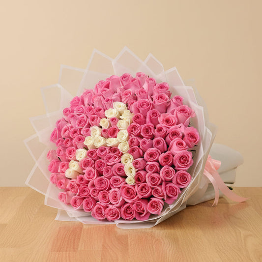 personalized letter flower arrangement with a mix of pink roses