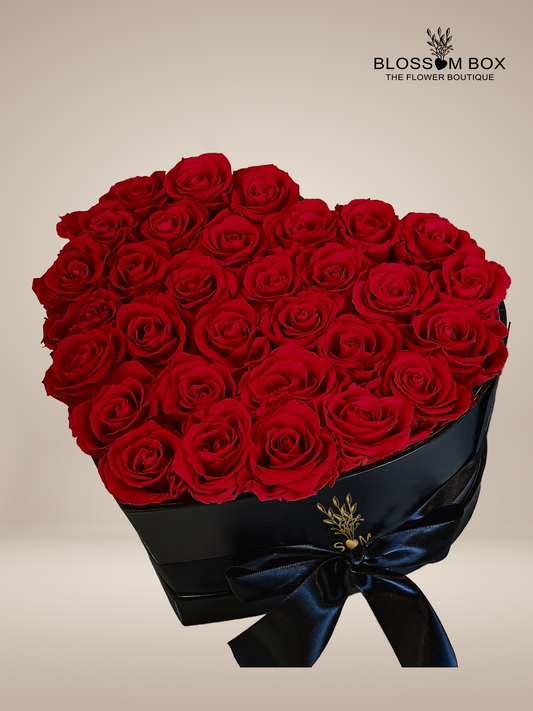 Red Roses in Black Heart Shape Box