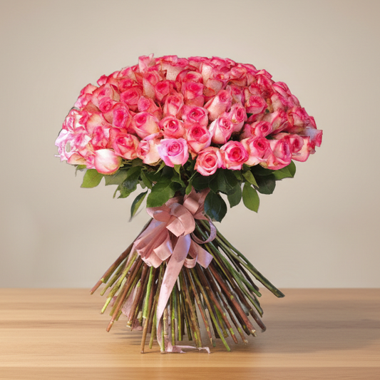 A hand bouquet of dual shade pink roses