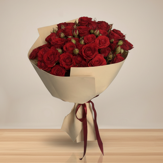 bouquet of red spray roses wrapped in brown paper